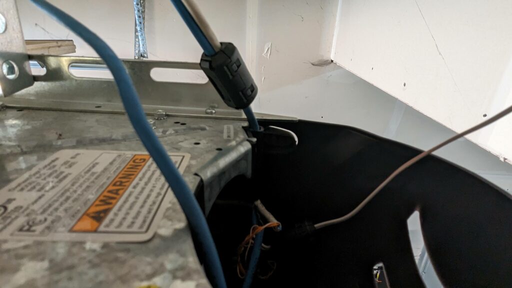 Ferrite cores on the wires going into the garage door opener controls