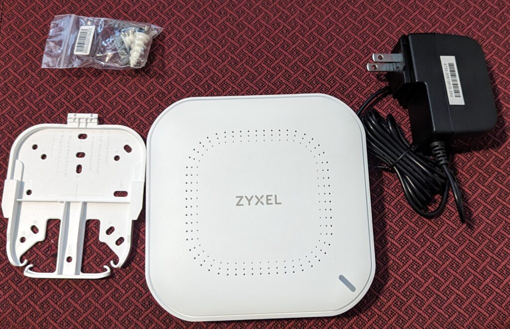 Zyxel NWA50AX package contents (Access point, adapter, mounting hardware)