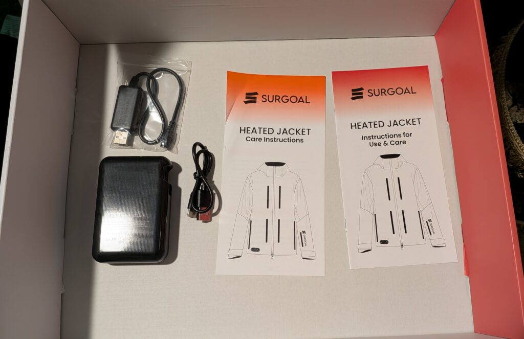 Surgoat Hardshell Heated Jacket battery, adapter, and instructions