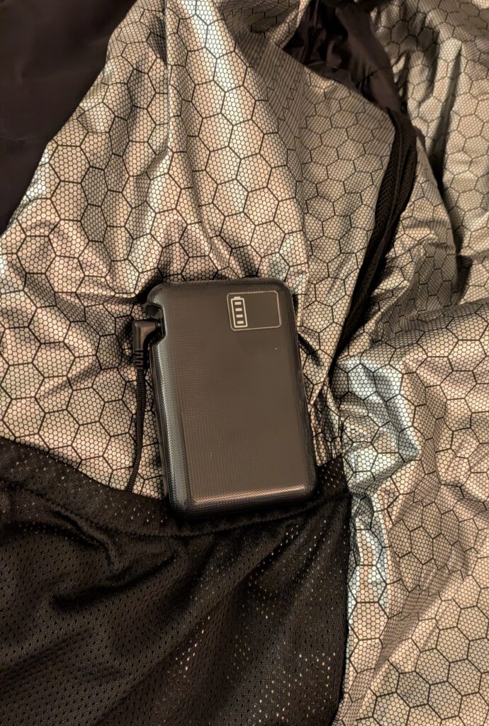 Surgoat Hardshell Heated Jacket powerpack outside of pocket